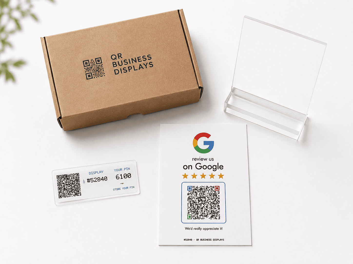 A QR Business Displays package with a printed Google Review Display, clear countertop holder, and Management QR and PIN label