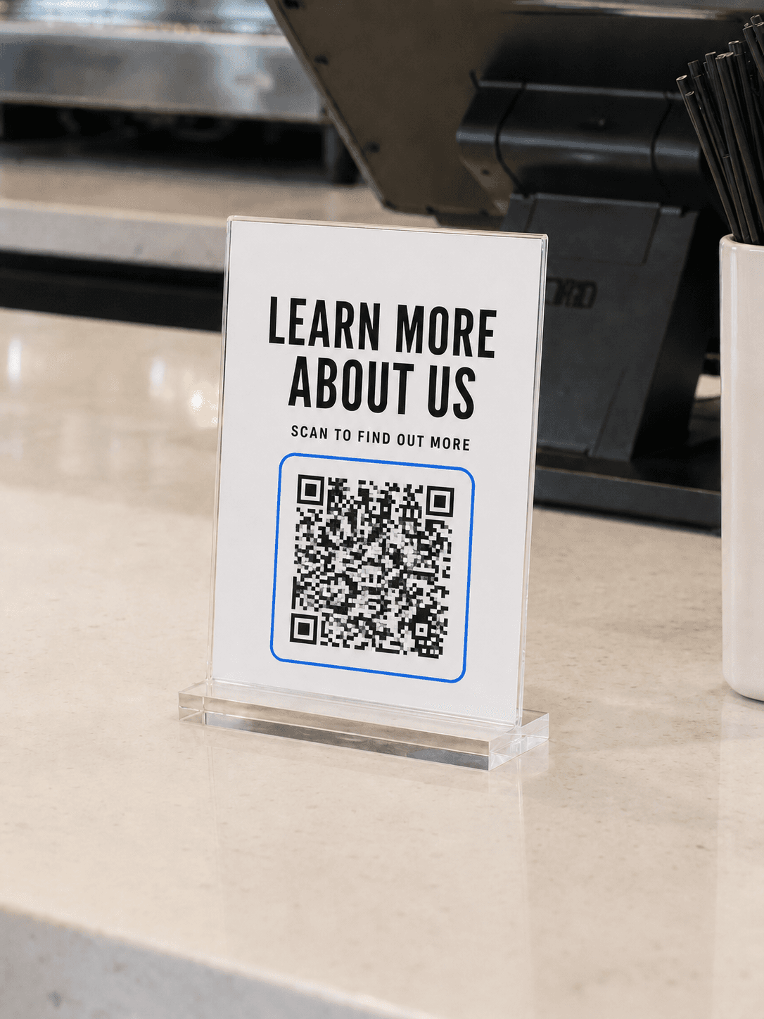 Learn More QR Display on a checkout counter
